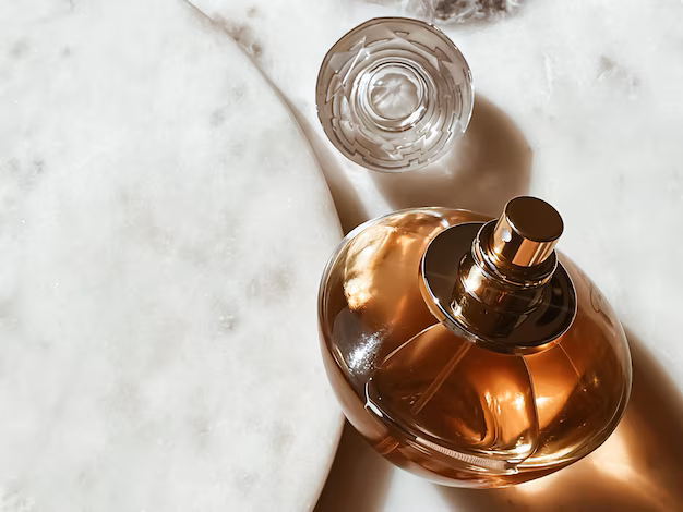 The picture shows an orange-colored perfume.